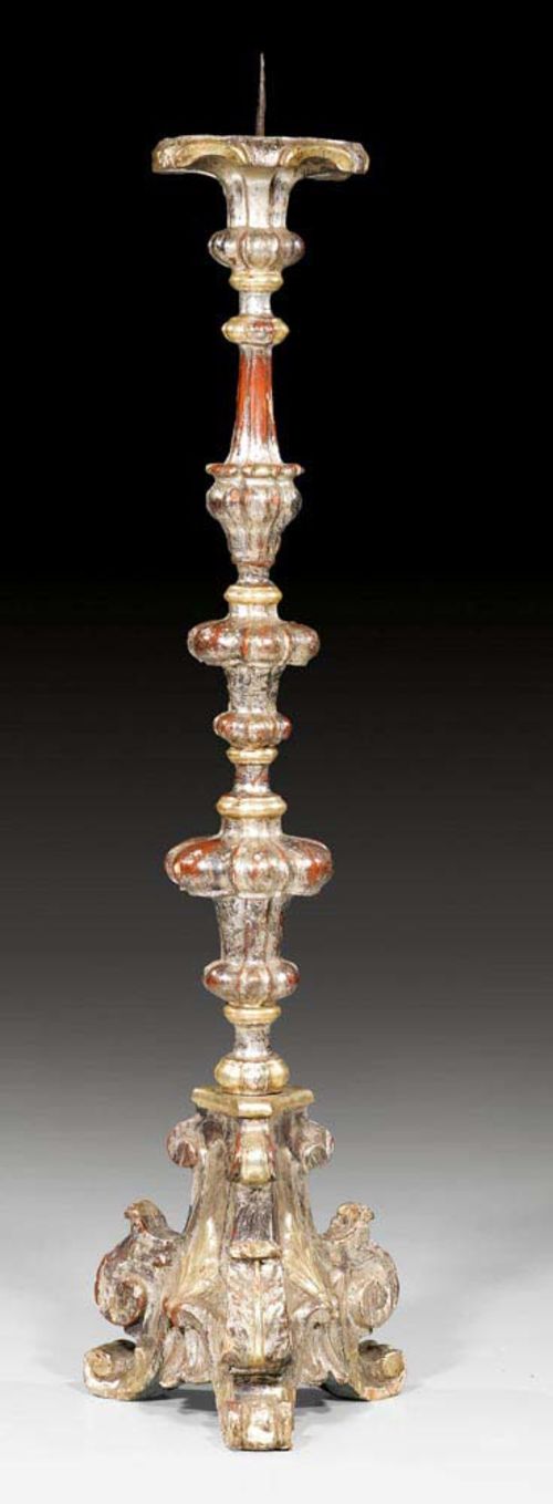 TALL CANDLEHOLDER,Baroque, probably northern Italy, 18th century. Shaped, carved and silvered wood. Iron spike. H 143 cm.