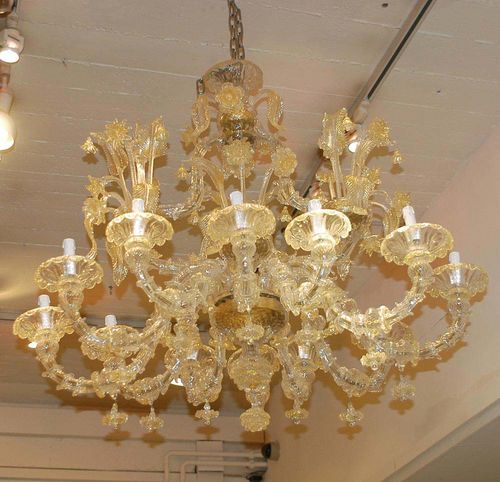 IMPORTANT CHANDELIER, Louis XV style, Murano. White cut glass. With baluster-shaped shaft and 12 light branches, richly decorated with applied flowers and leaves. Fitted for electricity. D approx. 120 cm, H approx. 100 cm.