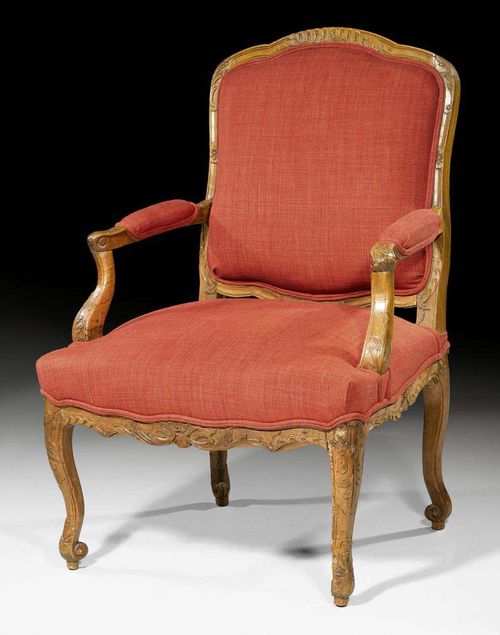 FAUTEUIL "A LA REINE", Regence, France circa 1720/40. Finely carved beech with leaves and frieze. Light red fabric cover. 67x53x48x98 cm. Provenance: - From a Belgium collection. - Galerie Koller Zurich 16.3.2008 (Lot No. 1135). - Swiss private collection.