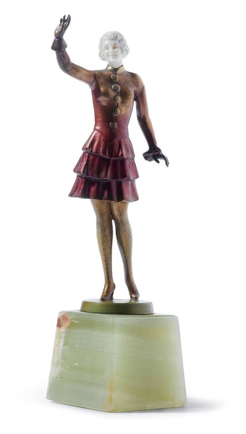 LIEBL, FIGURINE, c. 1930. Bronze and carved ivory. Young woman on green onyx base. Signed Liebl. The base with small repairs. H 20.5 cm.