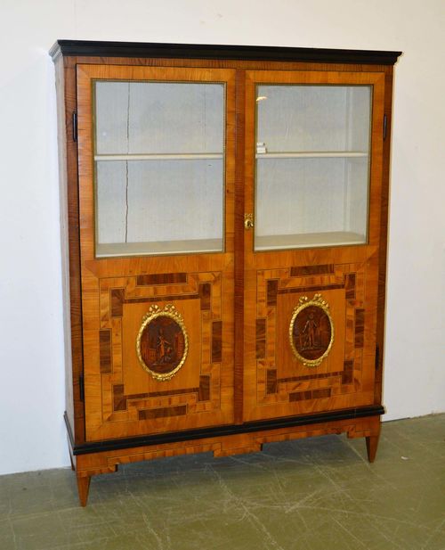 VITRINE,Louis XVI, probably Vienna ca. 1800. Cherry, elm and walnut partially ebonized. Rectangular body with glazed double doors. Opulent light/dark and broad and narrow fillet frame. 141x40.5x183 cm. 1 key.