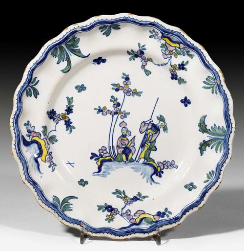 A FAIENCE PLATE WITH CHINOISERIE DECORATION, MOUSTIER, 18TH CENTURY.