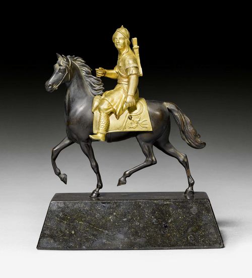 FIGURE OF A MONGOLIAN RIDER,early Baroque, the rider 17th century, the horse later, probably Vienna, 19th century. Gilt and burnished bronze with Zöblitz serpentine. The reins and weapon missing. The base chipped. L 17.5 cm. H 21.5 cm.