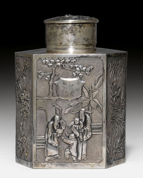 A SILVER HEXAGONAL TEA CADDY SHOWING A DRAGON AND GARDEN SCENE, WITH BIRDS AND FLOWERS.