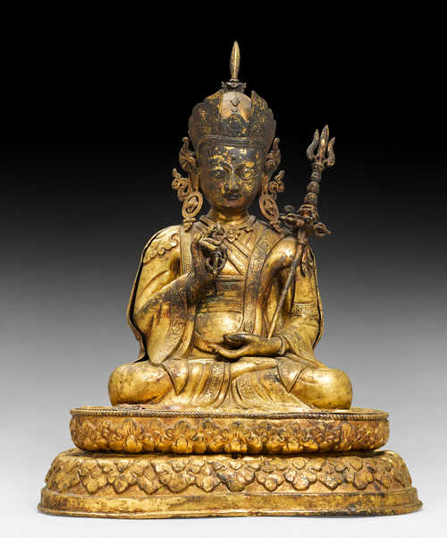 A LARGE GILT COPPER REPOUSSE FIGURE OF PADMASAMBHAVA.