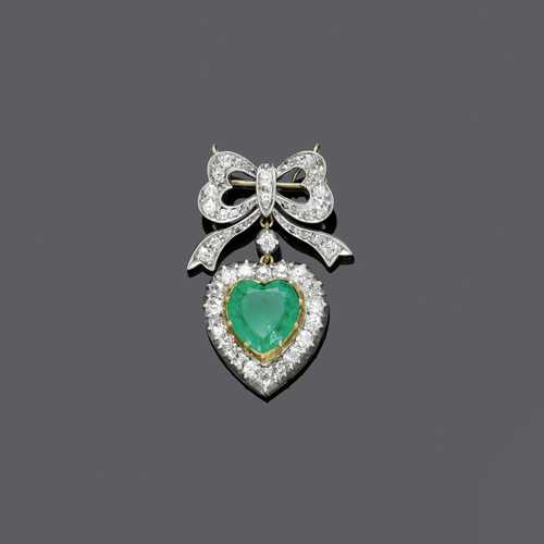 EMERALD AND DIAMOND BOW BROOCH, ca. 1910.