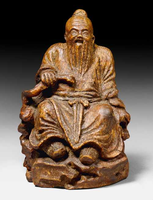 A BAMBOO CARVING OF AN OLD SCHOLAR.