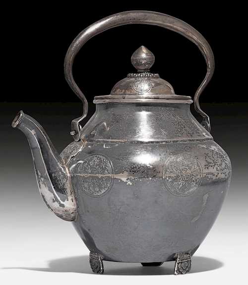 A SILVER TEAPOT.