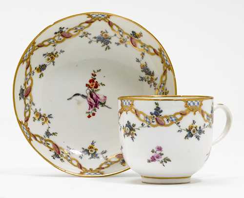 A CUP AND SAUCER,