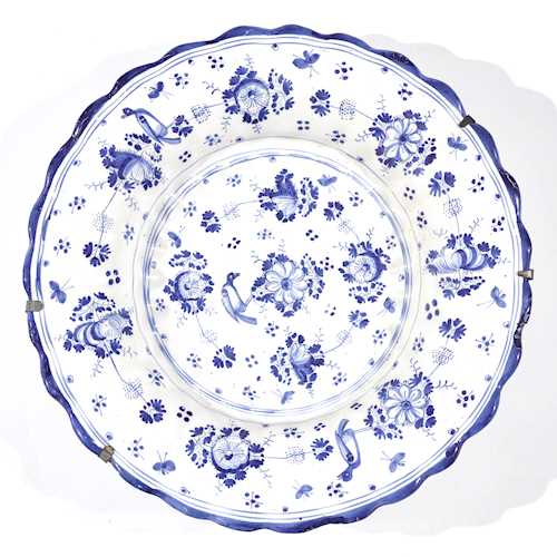 A FAIENCE FLUTED PLATE