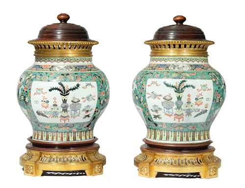 A PAIR OF MOUNTED VASES