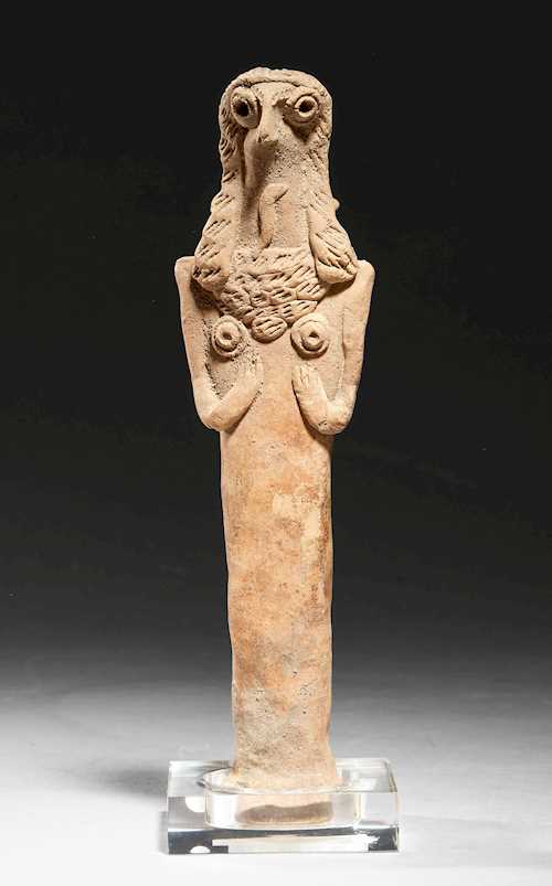 FEMALE PILLAR FIGURE WITH THE HEAD OF A BIRD