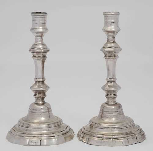 A PAIR OF SILVER-PLATED CANDLESTICKS