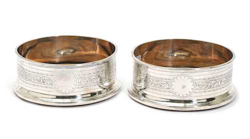 PAIR OF SILVER-PLATED BOTTLE COASTERS