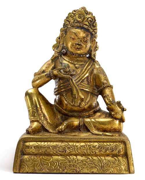 A SMALL GILT BRONZE FIGURE OF KUBERA.