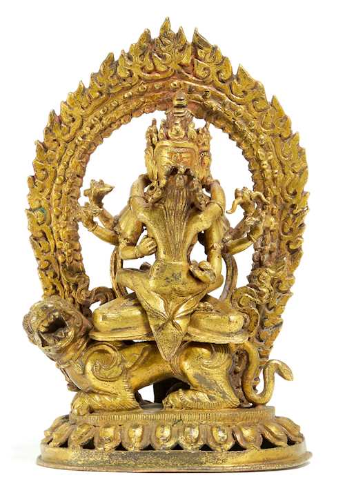 A GILT BRONZE FIGURE OF GUHYA-MANJUVAJRA YAB-YUM ON A LION.