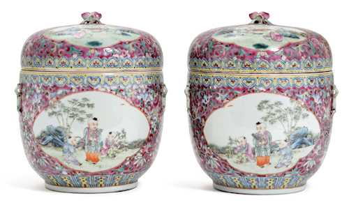 A PAIR OF FAMILLE ROSE LIDDED POTS.