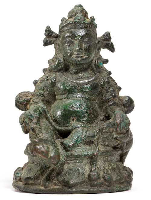 A MINIATURE BRONZE FIGURE OF KUBERA.