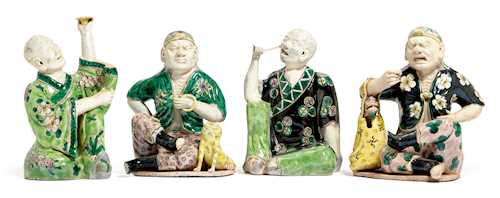 FOUR FAMILLE VERTE BISCUIT FIGURES OF ARHATS.