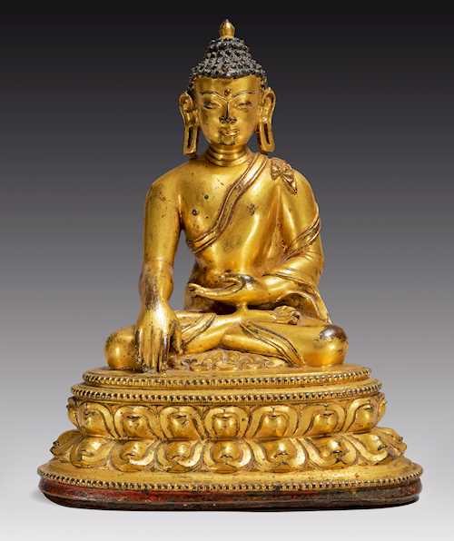 A WELL MODELLED GILT COPPER ALLOY FIGURE OF SHAKYAMUNI.