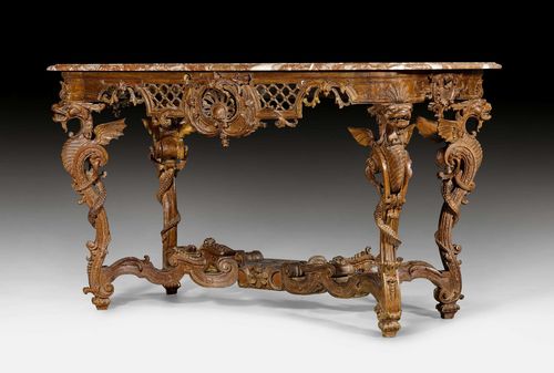 CONSOLE TABLE "AUX DRAGONS", Regence, probably after designs by J.B.H. TORO (Jean Bernard Honoré Turreau, Toulon 1672-1731 Paris), Paris ca. 1720. Oak, pierced and exquisitely carved with dragons, rosettes, lozenges, leaves, cartouches and decorative frieze. Profiled and slightly protruding "Brêche des Pyrénées" top. Some chips. Originally, probably gilt. 132x64x78 cm. Provenance: - from a European collection.