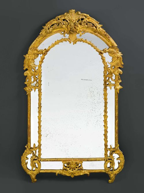 IMPORTANT MIRROR "AUX DRAGONS", Regence/Louis XV, Paris ca. 1720/40. Wood, pierced and opulently carved with dragons, flowers, leaves and decorative frieze, and gilt. Requires some restoration. H 194 cm. W 110 cm. Provenance: - Auction Koller Zurich, 2 December 2010  (Lot No. 1071). - from the collection of the Marquise de Amodio y Moya.