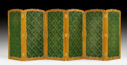 SIX-PART PARAVENT, Louis XV, Paris ca. 1740. Beech, moulded and finely carved with leaves and decorative frieze. Green velour cover with bullen nails. W 372 cm. H 129 cm. Provenance: - from a European collection.