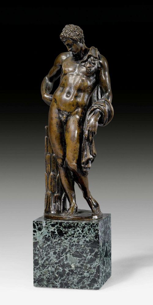 STATUETTE OF ANTINOUS,Renaissance, France, 17th century. Patinated bronze. Mounted on a green-black cube base. H figure 20.5 cm, with base 28 cm.