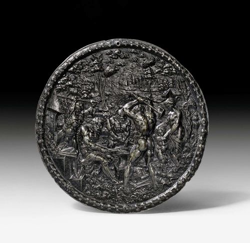 LEAD PLAQUE,Renaissance, after the monogrammist AC (first mentioned in 1577), probably Germany, 16th century. Seated Vulcan forging Cupid's wings, surrounded by workers, Venus and Cupid on the right. D 16 cm.