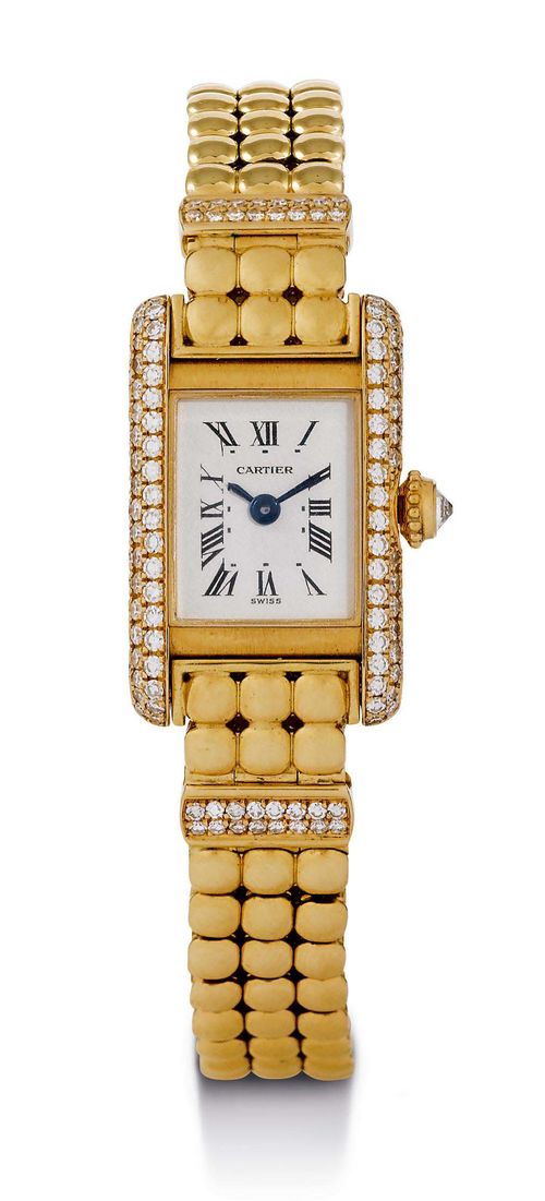 CARTIER TANK MINI, DIAMOND LADY'S WRISTWATCH, 1990s. Yellow gold 750. Slim, rectangular case No. 828003 1739, the sides set throughout with diamonds. Gold crown with diamond, screw-down back. Silver-plated dial with black Roman numerals and blued hands. Quartz movement. Supple, gold link band with 2 screwed gold links, each set throughout with 16 diamonds. D 24 x 15 mm.