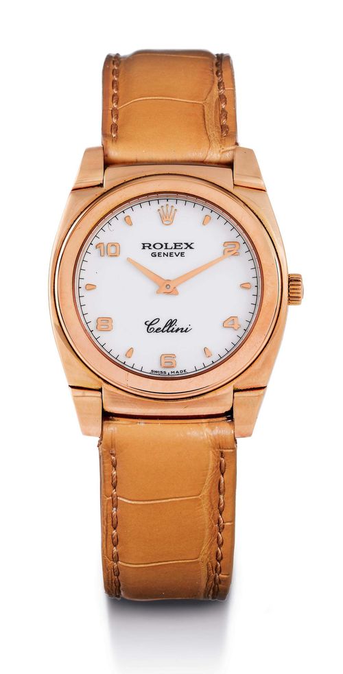 ROLEX CELLINI WRISTWATCH, 2000. Pink gold 750. Ref. 5320-5, tonneau-shaped case, No. A843674 with movable lugs, sapphire glass. White dial with applied Arabic numerals and pink gold indices and hands, signed: Rolex Genève Cellini. Rolex hand winding movement. Leather band with original pink gold clasp. D 38 x 32 mm. With original certificate and case by Bucherer.