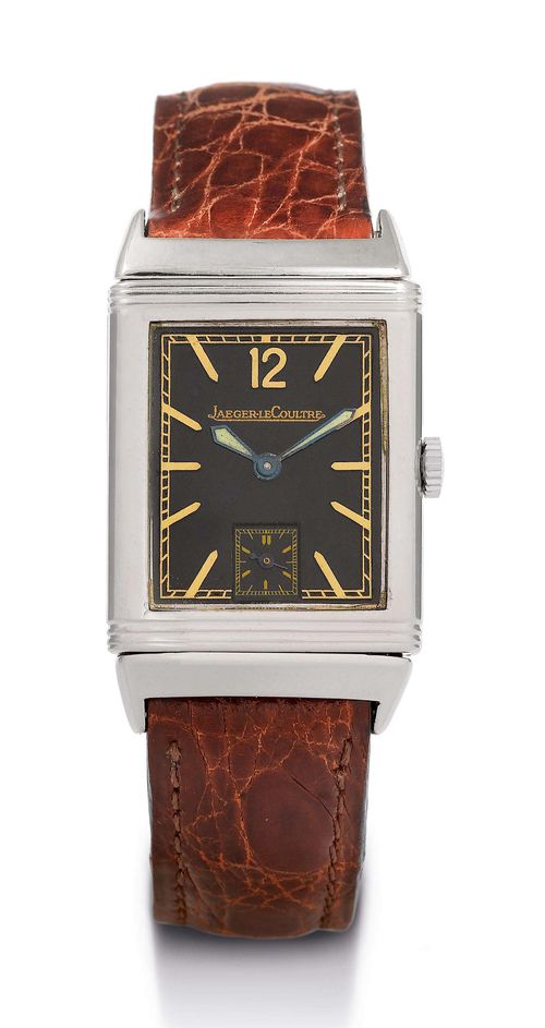 JAEGER LE COULTRE REVERSO WRISTWATCH, 1950s. Stainless steel Early, two-part case No. 41210, inscribed: Patent Acier Staybrite Fab. Suisse. Rotatable central part, for protecting the glass during sports activities. Black dial with raised indices, minute division and 12 in Arabic numerals. Small second at 6h, blued luminous hands. Tonneau-shaped Jaeger le Coultre Hand winding calibre. Brown leather band with steel clasp. D 38 x 23 mm.