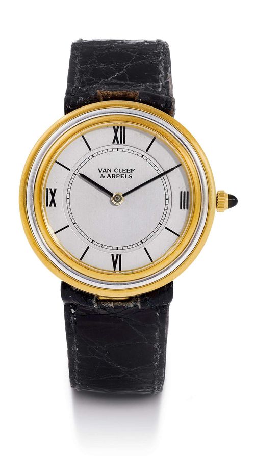 VAN CLEEF & ARPELS LADY'S WRISTWATCH, ca. 1980s. Yellow gold / white gold 750. Ref. G1525 G60. Round, yellow gold case No. 16100 with white gold ring, gold crown with onyx. Grey dial with black Roman numerals and black indices, black hands. Hand winding movement. Black leather band with original gold clasp. D 30 mm. With small, grey V&A leather pouch.