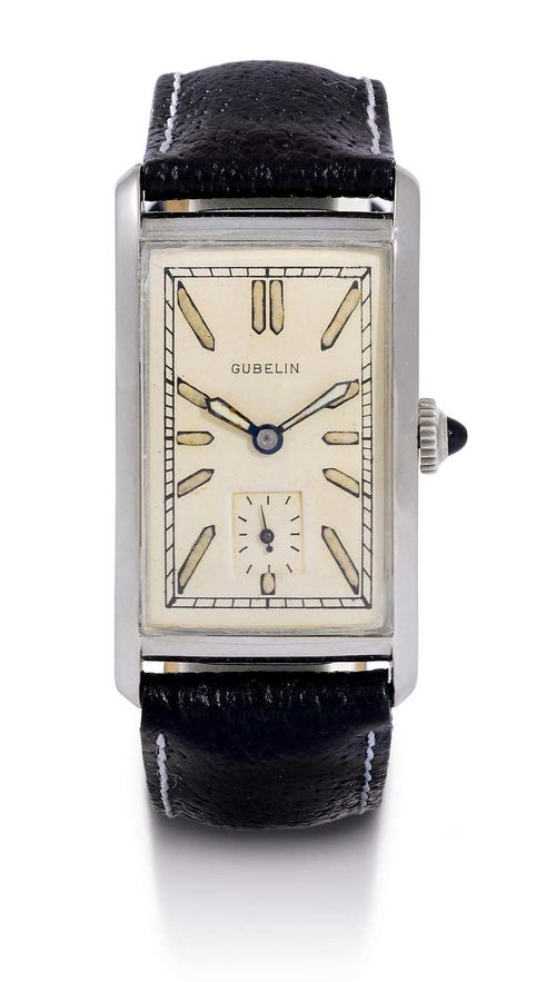 WRISTWATCH, IWC for GÜBELIN, 1930s. Steel. Rectangular, slightly convex case No. 956200, with sapphire-set crown. Silver-coloured dial with luminous indices and hands, small second at 6h. Hand winder, form movement No. 936370, with Breguet spring and bimetallic balance, signed. Black leather band with IWC clasp. D 39 x 22 mm. With excerpt from the archives, August 2007.