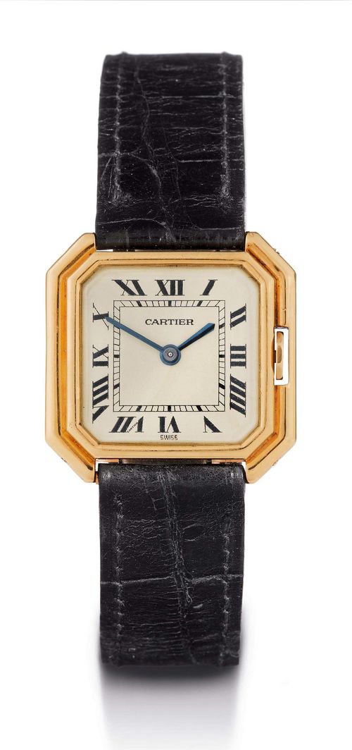 LADY'S WRISTWATCH, CARTIER, 1940s. Yellow gold 750. Octagonal case No. 42906 014830, with crown protection. Textured dial with Roman numerals and blued hands, signed Cartier. Mineral glass. Hand winding movement No. 1273980, Cal. 821 (Jaeger), signed Cartier. Black leather band with pink gold fold-over clasp, not original. D 27 x 27 mm.