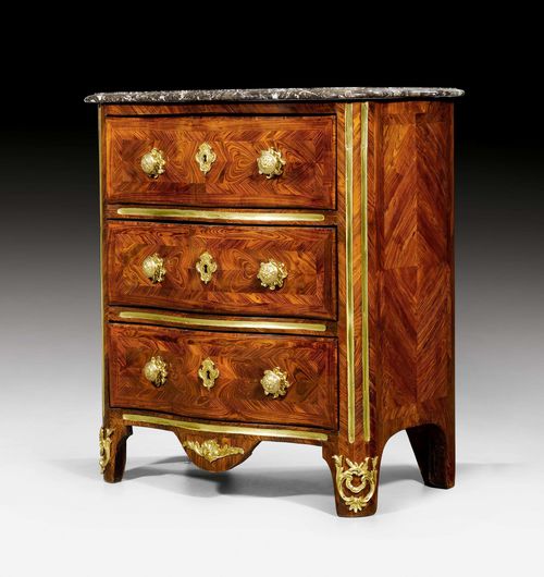 SMALL CHEST OF DRAWERS, Regence, Paris ca. 1730. Purpleheart and rosewood in veneer, inlaid "en papillon" and with reserves. The front with 3 drawers and fine brass fluting. Gilt bronze mounts. Shaped, grey/beige speckled marble top. 71x42x81 cm.