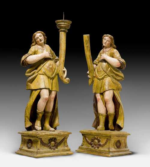 A PAIR OF CANDLESTICKS DESIGNED AS ANGELS