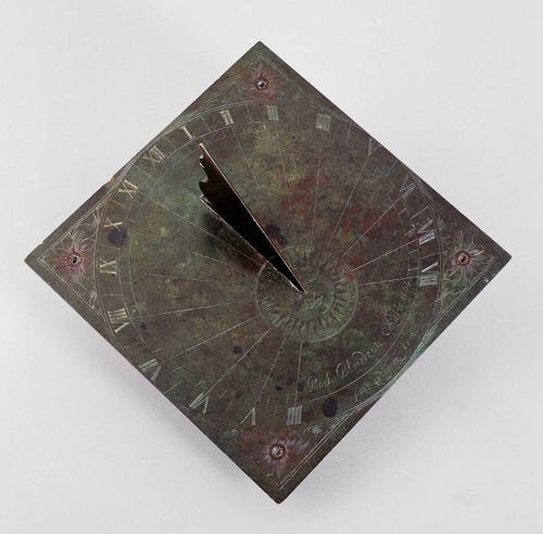 AN ENGRAVED BRASS GARDEN OR TABLE SUNDIAL, inscribed ROCH BLONDEAU PARIS 1664. Square ground plate with engraved hours, triangular gnomon. Feet possibly later, 1 loose. 17x17.5x10 cm.