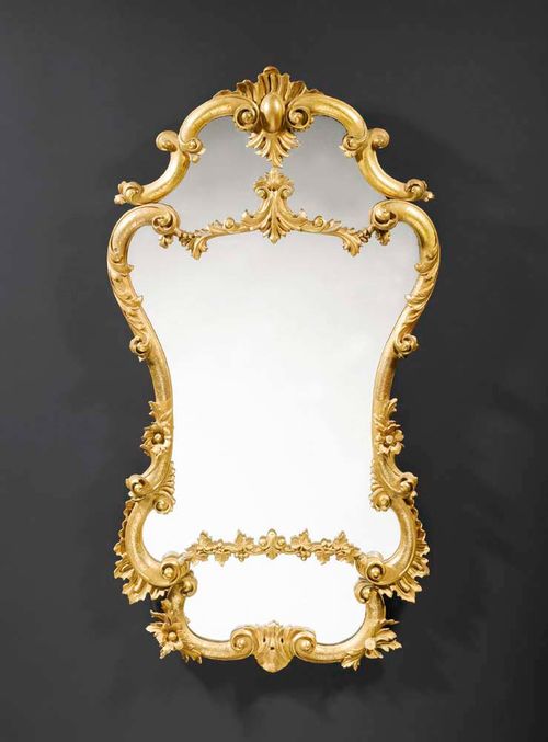 PIERCED AND CARVED GILTWOOD MIRROR,late Louis XV, Italy, 19th century Small losses. H 85 cm, W 56 cm. Provenance: Private collection, Zurich.