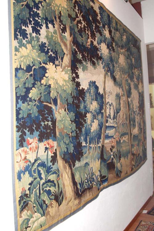 VERDURE TAPESTRY,Régence, France, 18th century Depicting a hunting dog and deer in idealised landscape. Slightly faded. H 200 cm, W 280 cm. Provenance: Private collection, Bern.