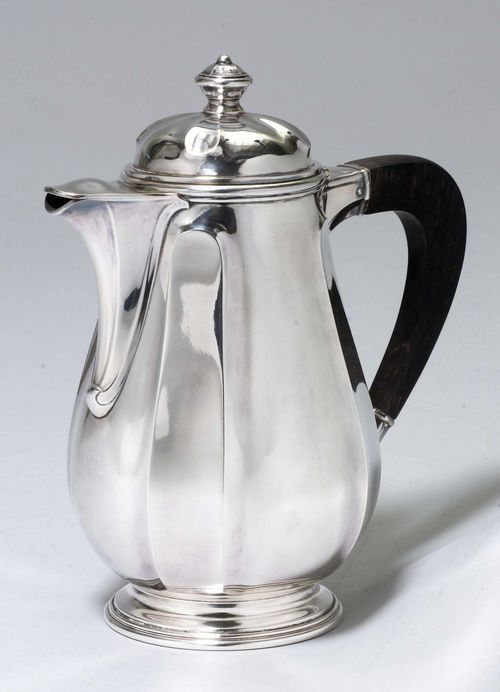 COFFEE POT,Paris, 1st half of the 20th century. Louis Gautier. Round, stepped base. Chased walls. Dark wood handle. Short beak-shaped spout and convex hinged cover with baluster finial. H 22 cm, 680 g.