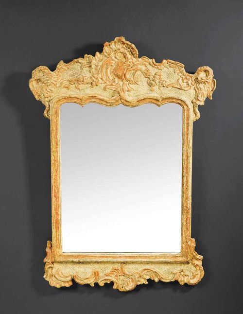 MIRROR, late Baroque, German, 18/19th century. Carved wood with traces of old gilding. H 90 cm, W 64 cm. Provenance: Private collection, Brissago.