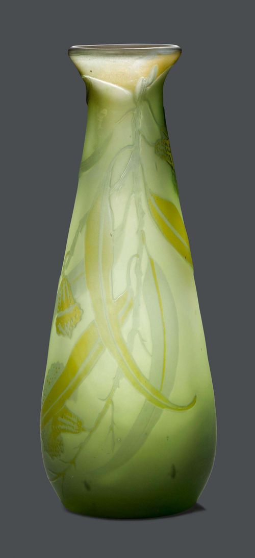 EMILE GALLE VASE, circa 1900 White glass with green overlay and etching. Conical vessel decorated with eucalyptus. Signed Gallé. H 20.5 cm.