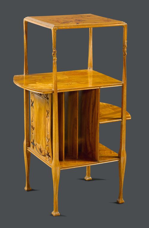 FRENCH MUSIC FURNITURE, circa 1900 Walnut, carved and inlaid with fruit woods. Rectangular with carved legs. Top and shelves inlaid with branches and leaves. H 102 cm. L 64 cm. D 42 cm.
