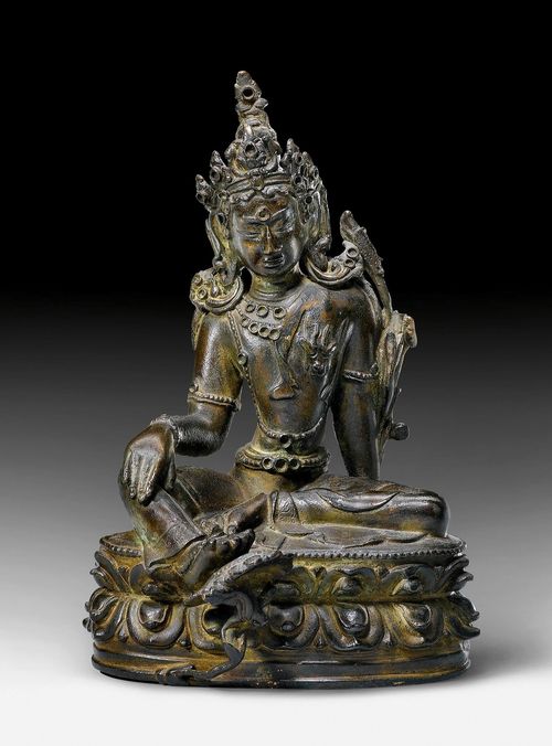 A DARK COPPER ALLOY FIGURE OF AVALOKITESHVARA.