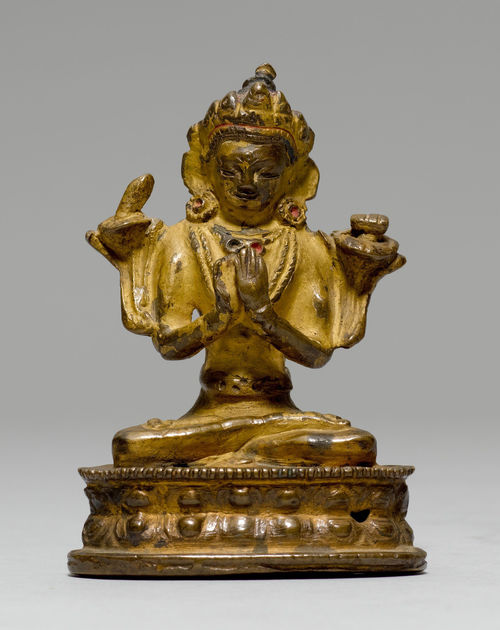 A BRONZE FIGURE OF MANJUSHRI SEATED ON A DOUBLE LOTUS THRONE.