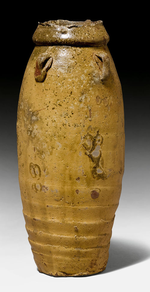 A OCHER GLAZED SETO VASE WITH FOUR SMALL EAR SHAPED HANDLES.