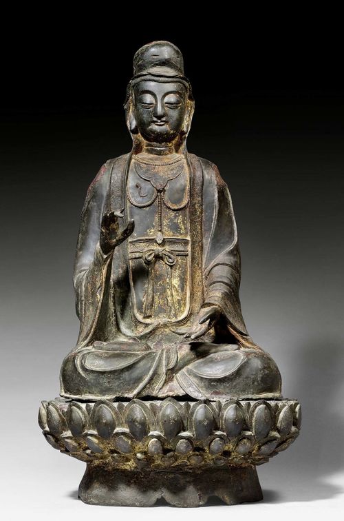 A LARGE BRONZE FIGURE OF BODHISATTVA GUANYIN. China, Ming dynasty, height 93 cm. Traces of gilding and red lacquer. Old restorations at shoulders and on the back.