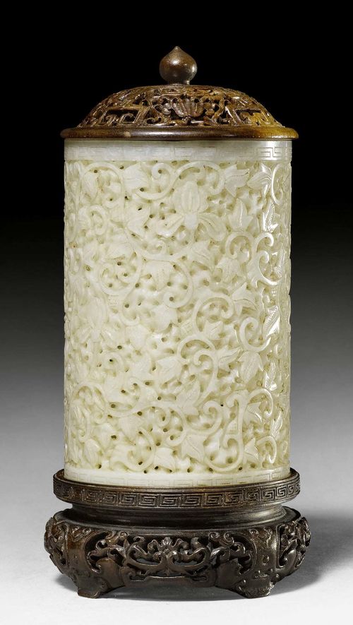 A WHITE JADE OPENWORK BRUSH POT. China, Qing dynasty, height 13 cm. Wood cover and stand. Without bottom.