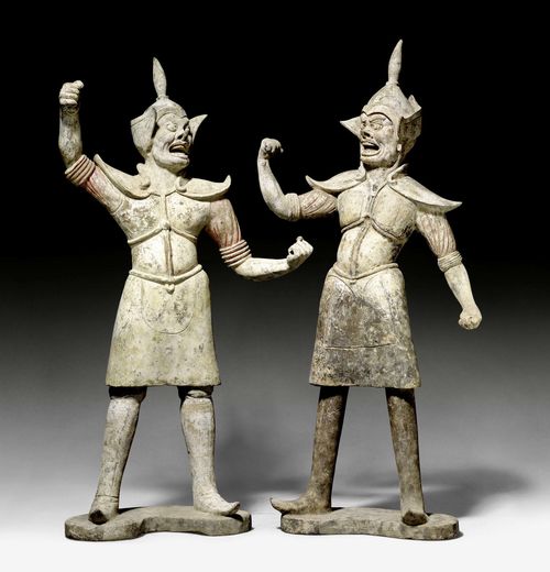 A PAIR OF PAINTED TERRACOTTA GUARDIAN FIGURES. China, Tang dynasty, height 91 and 94 cm.